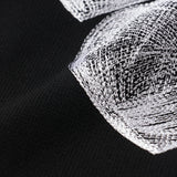Tricot brodé cœur « Titre inconnu » noir